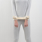 Both hands tie a belt approximately